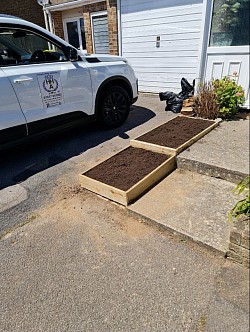 Slabs removed and Wooden flower beds installedstalled